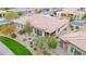 Aerial view of a home with a terracotta tile roof, nice patio and desert landscaping at 908 E Cereus Pass, Queen Creek, AZ 85140