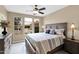 Serene bedroom with a large window, letting in natural light and offering a view of the outdoors at 908 E Cereus Pass, Queen Creek, AZ 85140