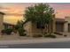 Charming desert-landscaped home with a two-car garage and a beautiful mature tree at 908 E Cereus Pass, Queen Creek, AZ 85140