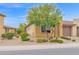 Charming desert-landscaped home with a two-car garage and a beautiful mature tree at 908 E Cereus Pass, Queen Creek, AZ 85140