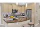 Kitchen featuring a central island with a marble countertop, stainless appliances at 908 E Cereus Pass, Queen Creek, AZ 85140