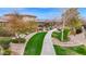 Well-maintained landscaping creates a serene pathway through the community at 908 E Cereus Pass, Queen Creek, AZ 85140