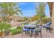 Outdoor patio with a table and chairs creating an inviting space for outdoor enjoyment and entertaining at 908 E Cereus Pass, Queen Creek, AZ 85140