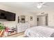 Bright bedroom featuring large dresser and television at 9329 W Topeka Dr, Peoria, AZ 85382