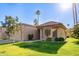 Inviting single-story home showcasing a landscaped front yard, tiled roof, and bright Arizona sunshine at 9329 W Topeka Dr, Peoria, AZ 85382