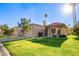 Inviting single-story home showcasing a landscaped front yard, tiled roof, and bright Arizona sunshine at 9329 W Topeka Dr, Peoria, AZ 85382