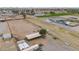 Aerial view of horse property featuring paddocks, riding arena, and luxurious home with pool at 97 W Marilyn Way, San Tan Valley, AZ 85140