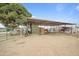 This property features a spacious outdoor horse shelter, perfect for equestrians and animal lovers at 97 W Marilyn Way, San Tan Valley, AZ 85140