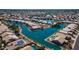 A wide aerial view showcasing the waterfront homes in a lakeside community, many with solar panels at 10332 W Potter Dr, Peoria, AZ 85382