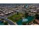 Overhead view of a neighborhood park with grassy area, palm trees and a pond with fountain at 10332 W Potter Dr, Peoria, AZ 85382