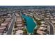 An aerial view of a beautiful neighborhood surrounding a lake with private docks and lush landscaping at 10332 W Potter Dr, Peoria, AZ 85382