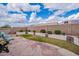 Spacious backyard with manicured lawn, desert landscaping, and secure block wall at 10332 W Potter Dr, Peoria, AZ 85382