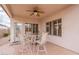 Covered patio with ceiling fan and table with four chairs at 10332 W Potter Dr, Peoria, AZ 85382