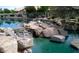 Picturesque rock water feature provides a serene setting by the water at 10332 W Potter Dr, Peoria, AZ 85382