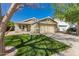 Charming single-story home with a well-manicured lawn and inviting front porch at 10704 E Plata Ave, Mesa, AZ 85212