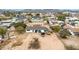 Aerial view of a home with ample parking, yard space, a storage shed, and neighboring houses in the area at 11512 E 6Th Ave, Apache Junction, AZ 85120