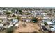 Aerial view of a home with a large lot and nearby residential neighborhood at 11512 E 6Th Ave, Apache Junction, AZ 85120