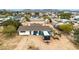 Aerial view of home with a generous outdoor area, shed, and proximity to other residences in the neighborhood at 11512 E 6Th Ave, Apache Junction, AZ 85120