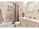 A full bathroom view, with a shower and tub combo, toilet, sink, and medicine cabinet at 11512 E 6Th Ave, Apache Junction, AZ 85120