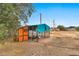 Coop for fowl with a protective enclosure, perfect for raising chickens in a backyard setting at 11512 E 6Th Ave, Apache Junction, AZ 85120