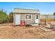 A storage shed equipped with double doors, a window, and ample space for storing tools and outdoor equipment at 11512 E 6Th Ave, Apache Junction, AZ 85120