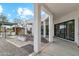 Inviting back patio with a modern fire pit, gravel accents, and covered entertaining space at 12201 N 66Th St, Scottsdale, AZ 85254