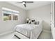 Neutral bedroom featuring a full-size bed, white walls, and lots of window light at 12201 N 66Th St, Scottsdale, AZ 85254