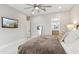 This is a neutral bedroom with an ensuite bathroom and ceiling fan at 12201 N 66Th St, Scottsdale, AZ 85254