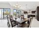 This is a dining area featuring an adjacent kitchen and sliding doors at 12201 N 66Th St, Scottsdale, AZ 85254