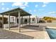 Outdoor living space featuring an outdoor kitchen and a seating area at 12201 N 66Th St, Scottsdale, AZ 85254