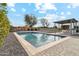 Beautiful backyard swimming pool with patio area and outdoor kitchen at 12201 N 66Th St, Scottsdale, AZ 85254