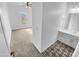 The ensuite bathroom features tiled floors, a white vanity, and is attached to the spacious primary bedroom at 12858 W Pasaro Dr, Peoria, AZ 85383