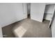 Neutral bedroom featuring carpet flooring, a closet, and natural light with bright white walls at 12858 W Pasaro Dr, Peoria, AZ 85383