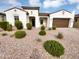 Charming single-story home featuring desert landscaping, a brown garage door, and a classic Spanish-tile roof at 12858 W Pasaro Dr, Peoria, AZ 85383