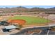 Community baseball field with fencing and covered seating near the parking lot at 13849 S 179Th Ave, Goodyear, AZ 85338