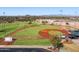 Aerial view of well-maintained baseball field with grass infield and outfield at 13849 S 179Th Ave, Goodyear, AZ 85338