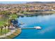 Beautiful community lake with dock and shoreline path providing stunning water views at 13849 S 179Th Ave, Goodyear, AZ 85338