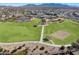 Expansive community park with green spaces, playground, volleyball court and tennis courts at 13849 S 179Th Ave, Goodyear, AZ 85338