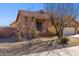 Charming single-story home featuring a tile roof, desert landscaping, and an attached two-car garage at 13849 S 179Th Ave, Goodyear, AZ 85338