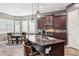 Stylish kitchen featuring a center island with bar seating and stainless steel appliances at 13849 S 179Th Ave, Goodyear, AZ 85338