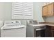 Laundry room with side-by-side washer and dryer at 13849 S 179Th Ave, Goodyear, AZ 85338