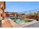 Backyard pool featuring waterfall, gazebo and manicured landscape at 13849 S 179Th Ave, Goodyear, AZ 85338