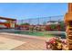 An inviting pool with a decorative water feature surrounded by plants and brick pavers, creating a serene outdoor space at 13849 S 179Th Ave, Goodyear, AZ 85338