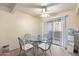 Comfortable dining area with glass table, ceiling fan, and sliding glass door to outdoor area at 1402 E Guadalupe Rd # 145, Tempe, AZ 85283