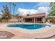 The backyard showcases a refreshing pool area with covered patio, perfect for relaxing and enjoying the outdoors at 14404 N 56Th Pl, Scottsdale, AZ 85254