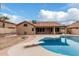 Backyard with a refreshing pool perfect for summertime fun, and covered patio for relaxing at 14404 N 56Th Pl, Scottsdale, AZ 85254