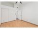 Bedroom featuring wood floors and a closet with sliding doors at 14404 N 56Th Pl, Scottsdale, AZ 85254