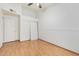 Bedroom featuring wood floors, closet with sliding doors and adjacent door frame at 14404 N 56Th Pl, Scottsdale, AZ 85254