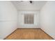 Bedroom with wood floors, neutral walls, and bright window at 14404 N 56Th Pl, Scottsdale, AZ 85254