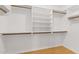 Walk-in closet with built-in shelves and rods to maximize storage space at 14404 N 56Th Pl, Scottsdale, AZ 85254